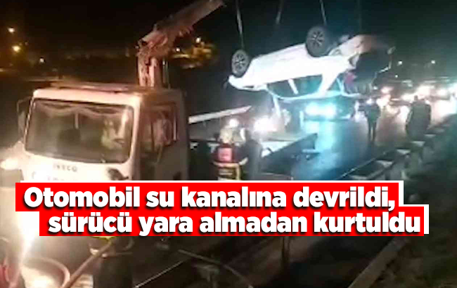 Otomobil su kanalına devrildi, sürücü yara almadan kurtuldu